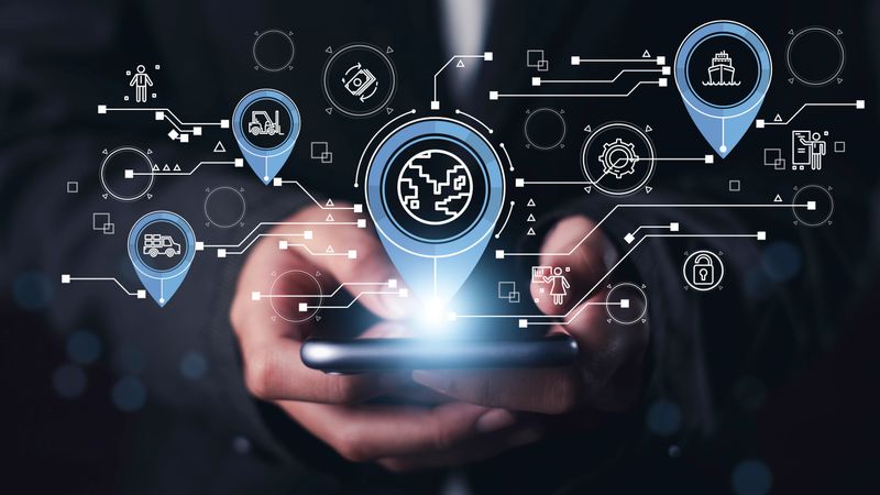 Global logistics and real-time tracking concept with mobile device showing digital map pins for shipping, delivery, warehouse, Supply chain operations, enhancing worldwide distribution efficiency.