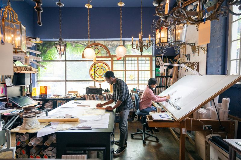 Team of architects working in the studio on a home renovation project