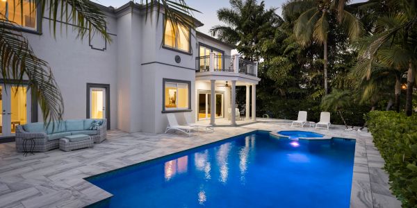Elegant house with swimming pool at twilight.