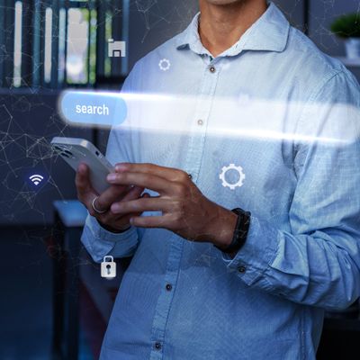 Person using smartphone with digital search interface overlay.