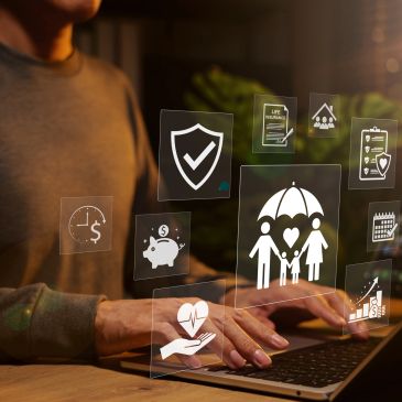 Person accessing digital insurance and financial icons on laptop.