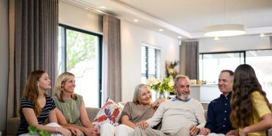 Family members enjoying time together in a living room.