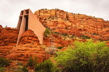 Chapel nestled in red rock canyon.