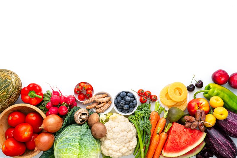 Healthy fruits and vegetables shot from above, flat lay. Organic source of vitamins and minerals, Raw food for health and wellness. Juicy and colorful farm to table produce