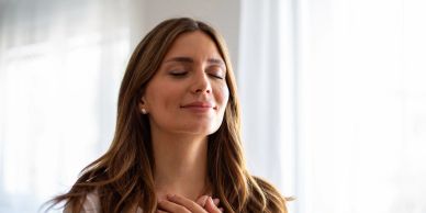 Woman enjoying a peaceful moment with closed eyes.