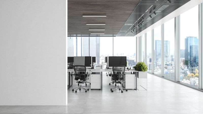 Modern empty office room with white blank wall.