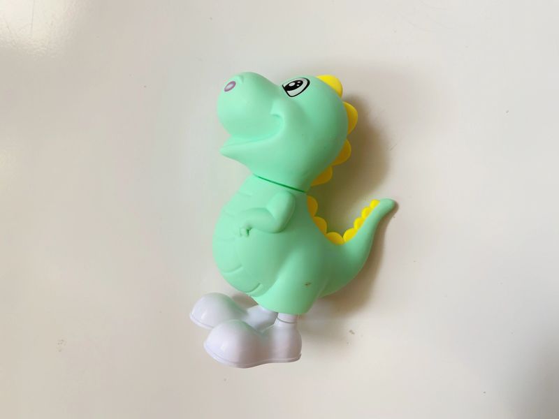 white isolated dinosaur shaped children's toy