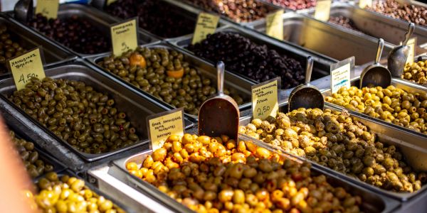 Various kinds of olives displayed for sale.