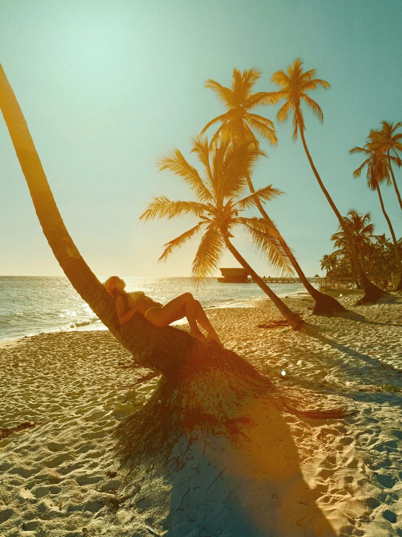 Young woman enjoying summer vacations on a beautiful tropical beach