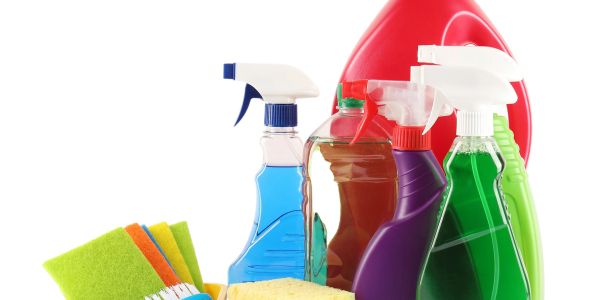 Various colorful cleaning supplies and sponges.