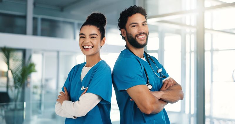 Arms crossed, medical and portrait of nurse people in hospital for collaboration or support. Healthcare, internship and smile of medicine students in clinic together for professional residency