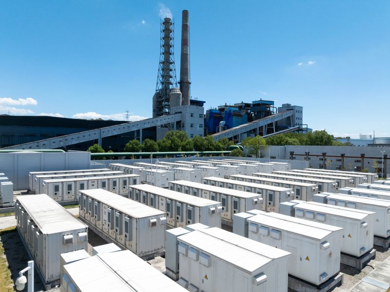 Aerial view of battery energy storage systems under a clear blue sky