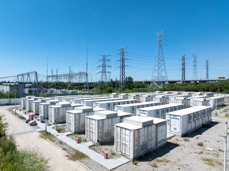 Aerial view of battery energy storage systems under a clear blue sky