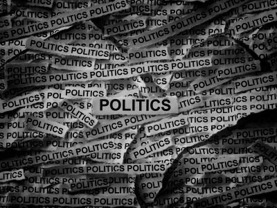 Collage of torn papers with the word 'POLITICS'.