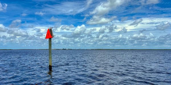 Channel marker in water.