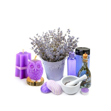 Lavender-themed spa set with candles, dried flowers, and bath accessories.