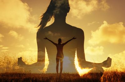 Meditative figures blending with sunset sky.