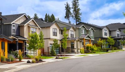 Row of modern suburban houses on a sunny day.