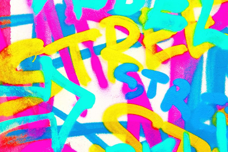 Vibrant graffiti art in neon pink, blue, yellow. 80s street style, funky, colorful, bold lines. Urban posters, digital art, vibrant 80s, 2000s creative banner.