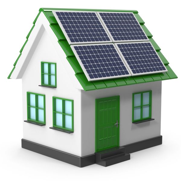 Small white house with green roof and solar panels.