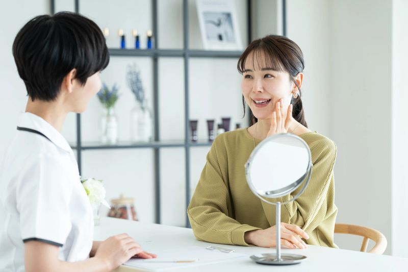 A young woman receiving counseling at a beauty salon
