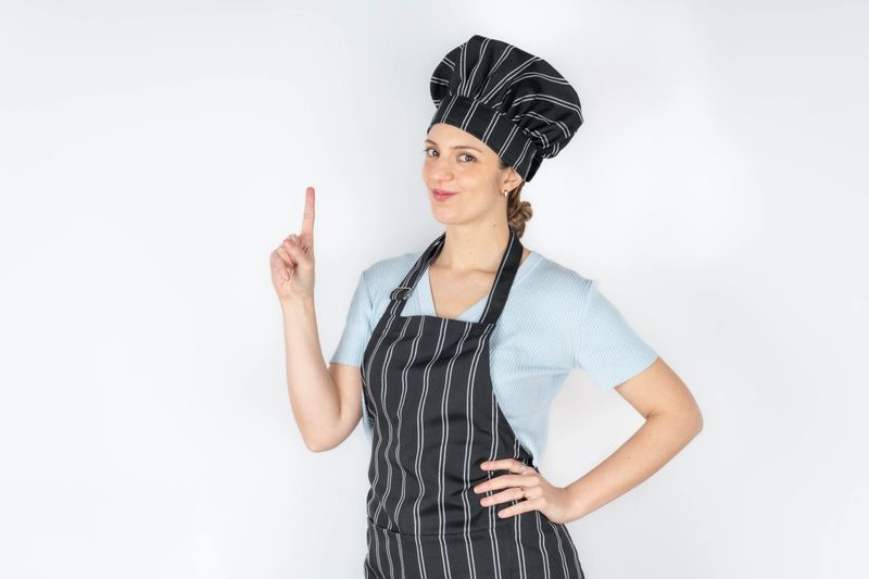 Happy culinary expert showing a great idea expression