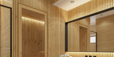 Modern bathroom with wooden paneling and a sleek white basin.