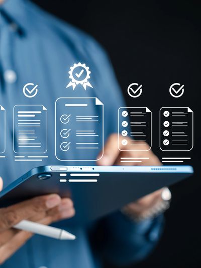 Person using tablet with digital checklist icons.