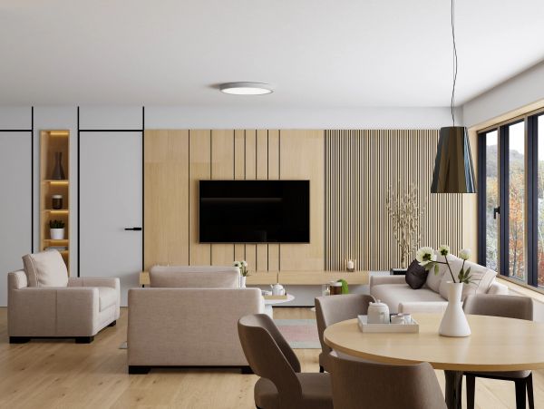 Modern living room with beige sofas and wooden accents.