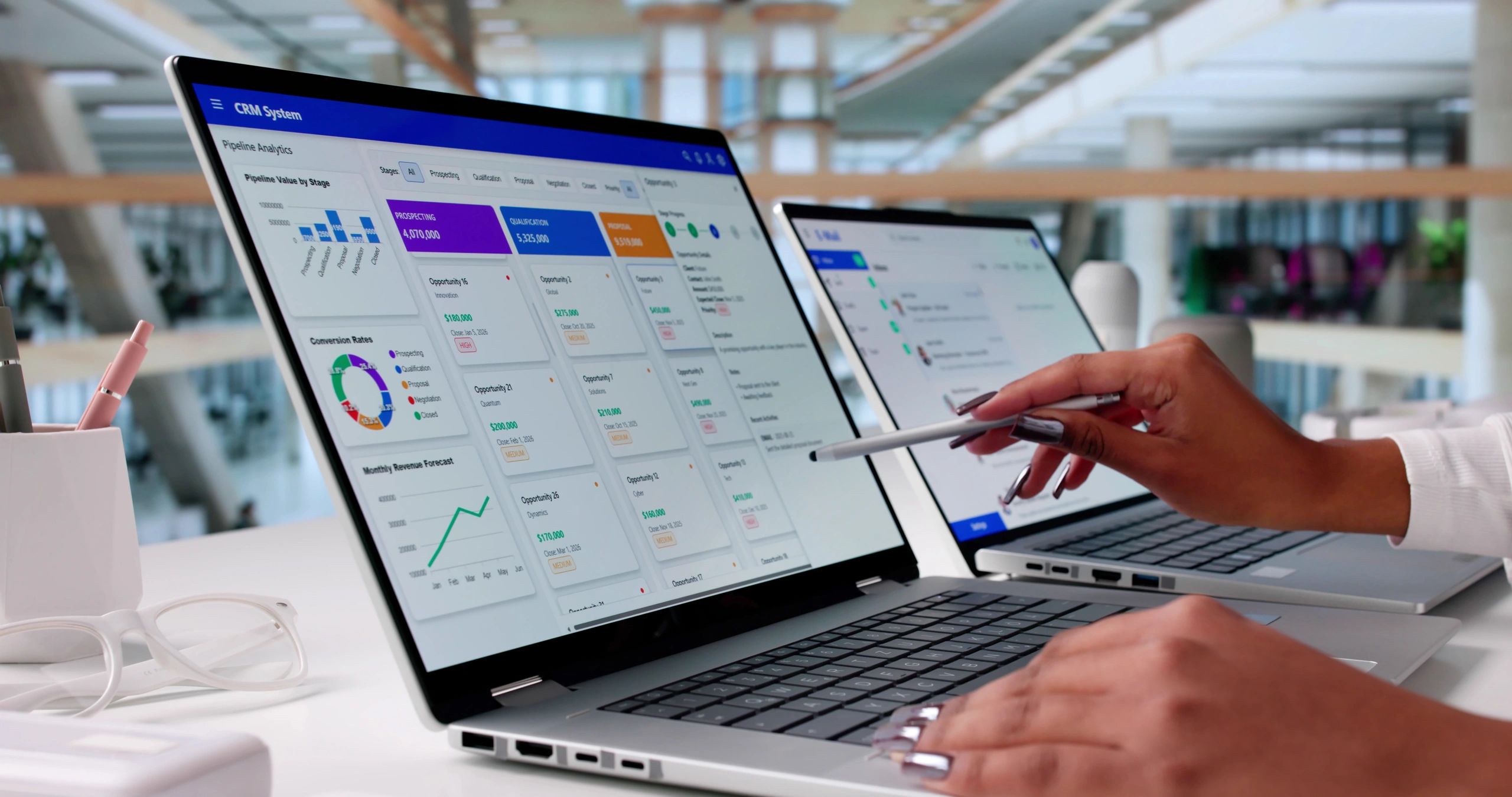 Person analyzing CRM system data on a laptop.