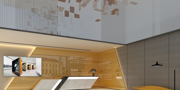 Modern lobby with sleek reception desk, yellow accent wall, and artistic ceiling installation.