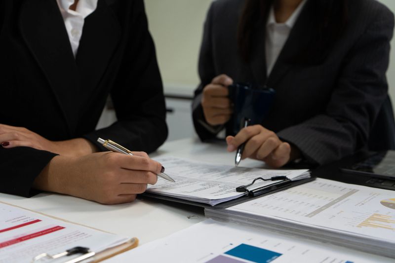 Business Team Analyzing Reports and Financial Documents