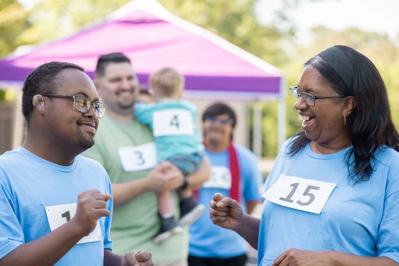 Mother runs charity benefit marathon with her young adult son who has Down Syndrome