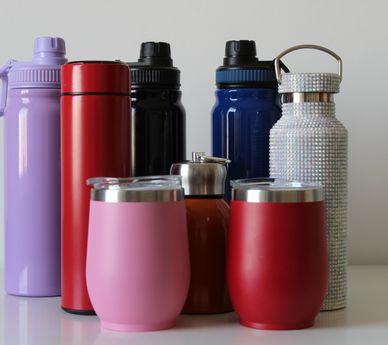 Colorful tumblers with a horse logo and text for 2023.
