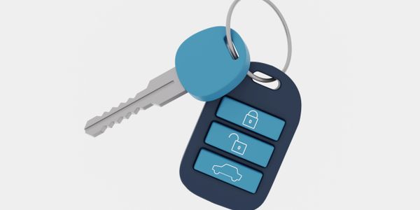 Car key with remote control buttons on a keyring.