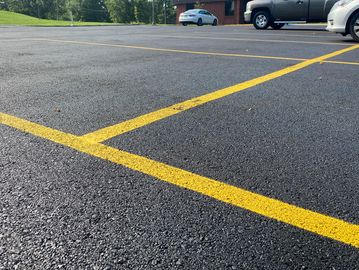 Empty parking lot with yellow lines.