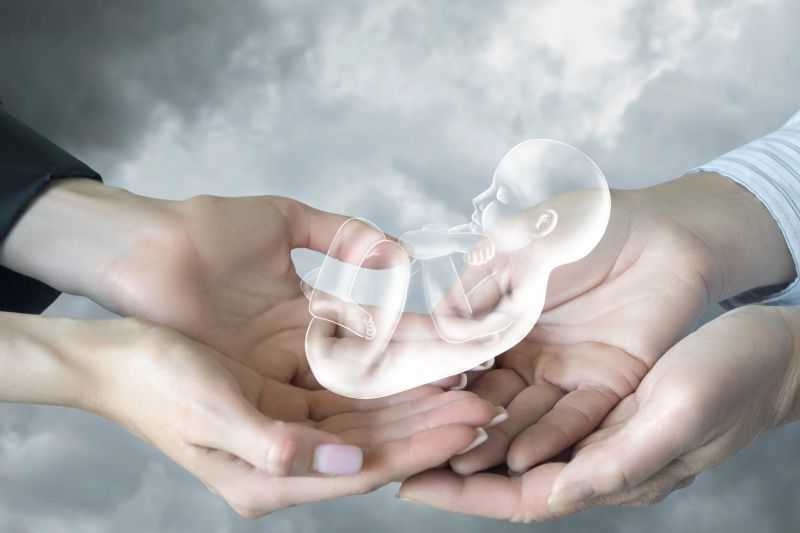 Miracle of life in gentle hands under a cloudy sky. Two hands cradle a glowing figure symbolizing new life amidst a dreamy backdrop.
