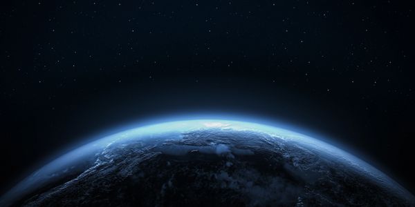 View of Earth from space at night with stars.