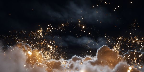 Golden sparks flying above clouds at night.