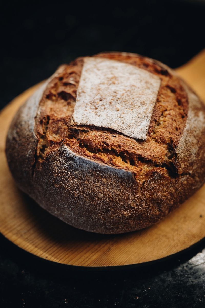 Fresh bread on wooden background