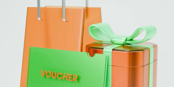 Orange gift bag, green voucher, and orange gift box with green ribbon.