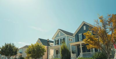 Sunny day with a row of colorful houses.