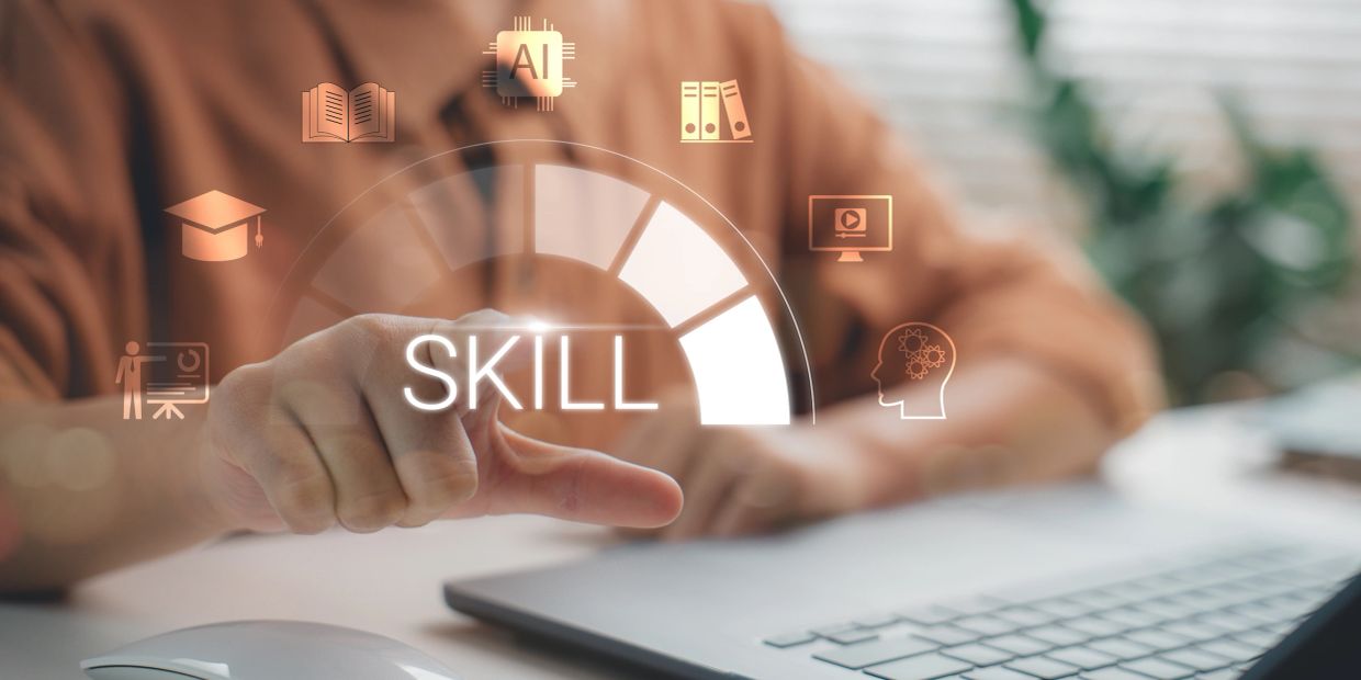 Person interacting with a digital skill meter and education icons.