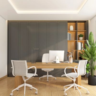Modern office with wooden desk, white chairs, and built-in shelves with plants and books.