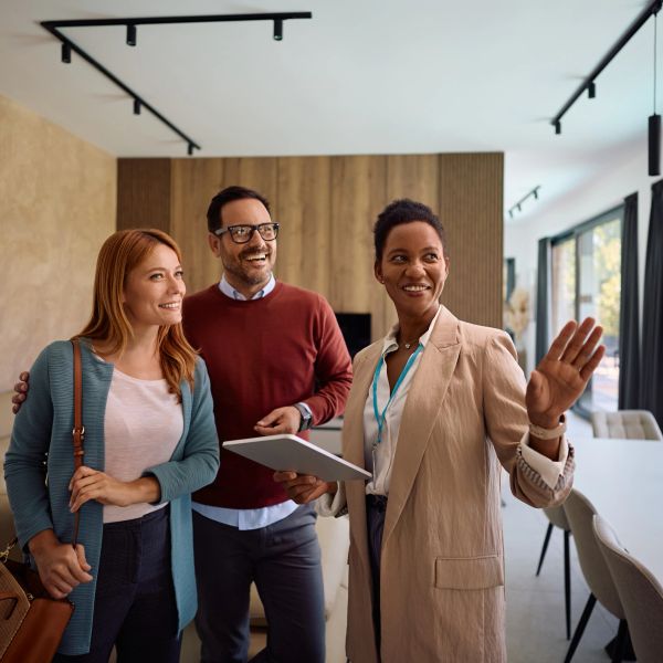 Real estate agent showing a couple a property.