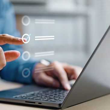 Person interacts with a digital checklist on a laptop.
