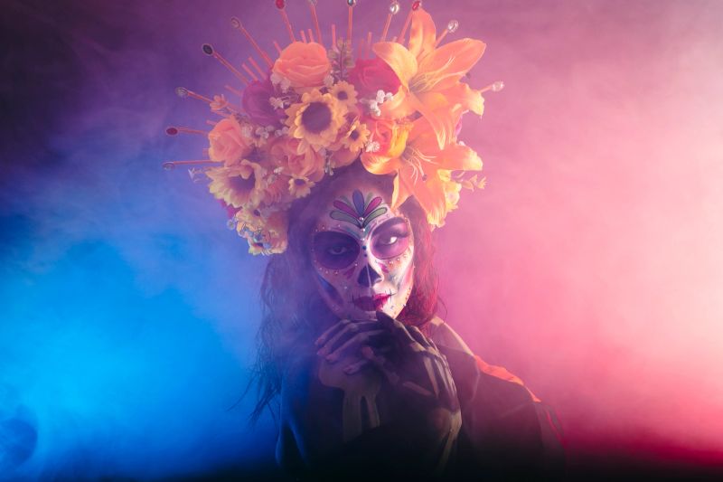 Mexican Catrines posing and displaying their beauty and culture full of colors, shapes, and feelings, showing their elegance.
