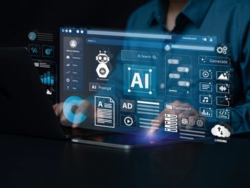 Person interacting with futuristic AI interface on laptop.