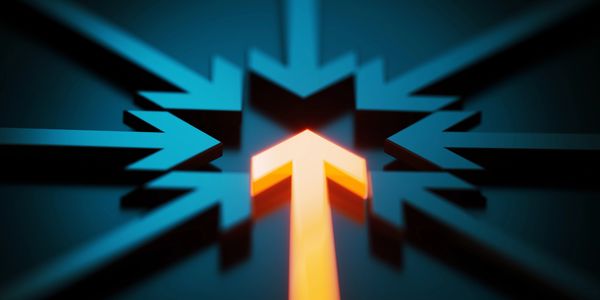A glowing arrow pointing forward amidst other dark arrows converging.