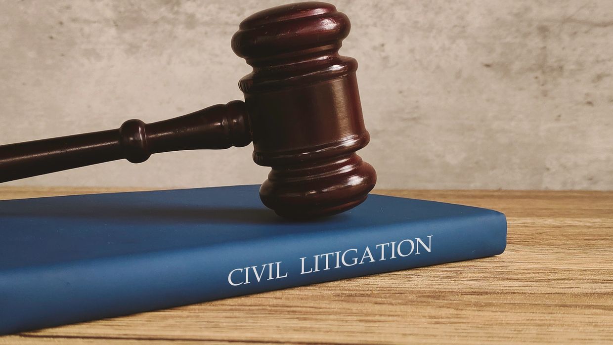 Gavel resting on a book titled Civil Litigation.